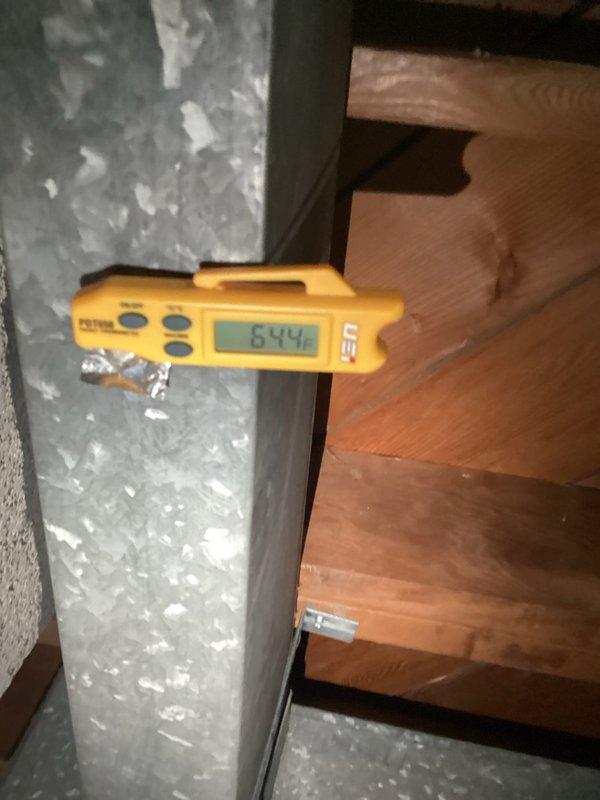 Completed HVAC tune-up service on residential system. Performed temperature and airflow measurements at supply ductwork, recording 64.5°F supply air temperature. Identified significant frost accumulation on evaporator coil and ductwork, indicating potential refrigerant charge issue, restricted airflow, or low ambient conditions affecting system performance. Documented measurements showing 462 CFM airflow at time of inspection.