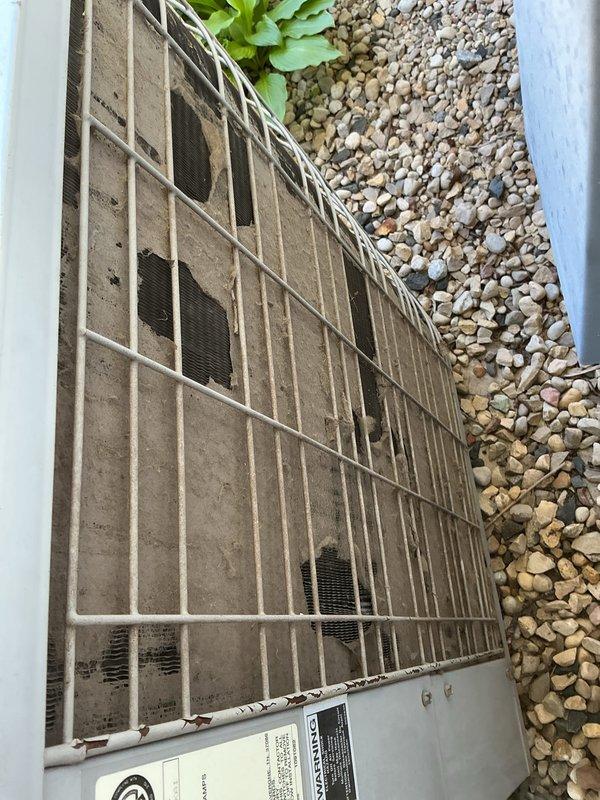 Completed annual tune-up maintenance on residential HVAC system with attic-mounted air handler and ground-level condenser unit. Accessed evaporator coil in attic using ladder, inspected coil fins which showed moderate dust accumulation, cleaned condenser unit exterior using 100-foot hose, and replaced air filter. Both indoor and outdoor components were inspected and found to be operating within normal parameters following routine maintenance procedures.