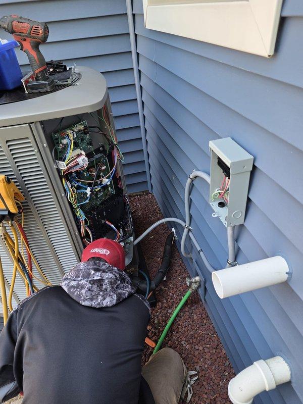 # HVAC Installation Completed

Successfully completed full air conditioning system and evaporator coil installation at residential property. Installed new outdoor condensing unit in side yard location between building walls, positioning unit on stable base with proper clearances for serviceability. Mounted electrical disconnect box on exterior wall and completed all required electrical connections per manufacturer specifications and local code requirements. Ran and secured PVC condensate drain line with proper pitch and termination point.

Inside mechanical room, installed new evaporator coil in existing air handler system. Completed refrigerant line connections between indoor and outdoor units, pressure tested system for leaks, evacuated lines to proper vacuum levels, and charged system with appropriate refrigerant type and quantity per equipment specifications. Verified proper airflow across coil and confirmed all electrical connections at air handler are secure and properly terminat