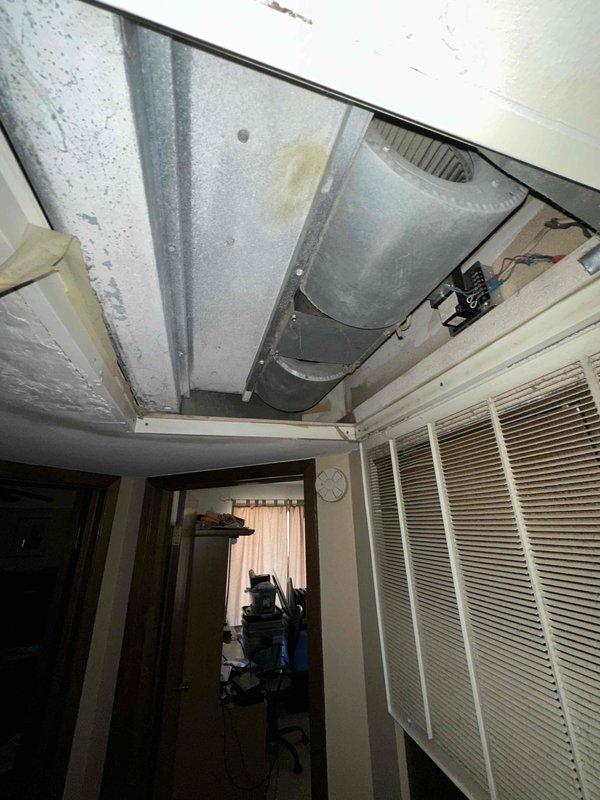 Completed on-site estimate for air handler replacement in residential property. Accessed ceiling cavity to inspect existing HVAC equipment, documenting current air handler configuration, ductwork connections, and installation conditions. Provided homeowner with replacement recommendations and specifications for new equipment installation.
