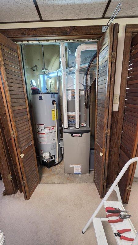 Completed installation of high-side air conditioning components including new evaporator coil integrated with existing furnace system. All refrigerant lines were properly insulated and routed, electrical connections verified, and condensate drainage system installed per manufacturer specifications.