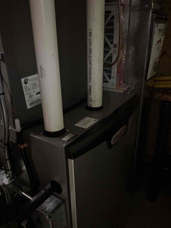 Performed annual tune-up on residential HVAC system. Inspected outdoor condenser unit and noted dirt accumulation on coil fins; cleaned condenser coils to restore proper airflow and heat transfer efficiency. Evaluated indoor furnace/air handler unit in mechanical room, verified proper operation of all components. Inspected Ecobee thermostat programming and confirmed system is operating on programmed schedule as requested; reviewed schedule settings with occupant to ensure comfort preferences are met.