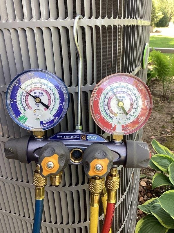 Performed comprehensive tune-up on Carrier air conditioning system. Connected manifold gauges to verify refrigerant pressures and system performance, confirmed proper operating pressures on both high and low sides. Applied coil cleaner to condenser unit and cleaned exterior fins to restore optimal heat transfer efficiency and airflow.