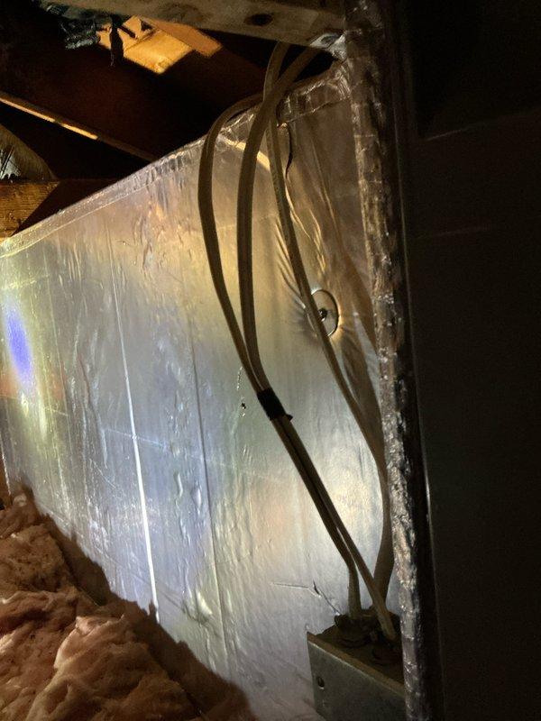 Responded to emergency service call for attic-mounted air handler originally scheduled for routine maintenance. Upon inspection, discovered 36-year-old unit with critically low R22 refrigerant levels, indicating system had reached end of serviceable life. Due to age of equipment, unavailability of R22 refrigerant, and cost-prohibitive nature of repairs, provided comprehensive estimate for complete HVAC system replacement. Documented existing air handler and ductwork configuration in confined attic space with limited accessibility requiring crawl-only access. Recommended full system upgrade to modern, energy-efficient equipment with current refrigerant standards.