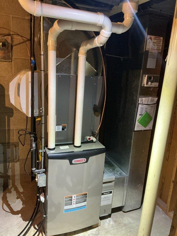 Completed preventive maintenance tune-up on residential split system HVAC equipment, including Lennox furnace and outdoor condensing unit. Performed comprehensive inspection of indoor air handler with refrigerant lines, verified electrical connections and controls, and serviced outdoor condenser unit requiring cleaning of protective grilles showing dirt accumulation and weathering. All components operational and system functioning within normal parameters upon completion.