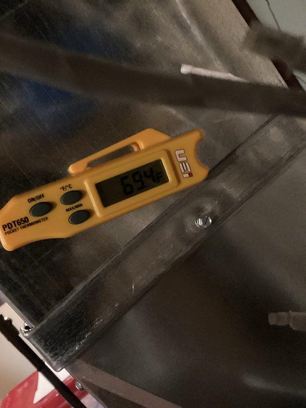 Completed HVAC system tune-up and performance verification. Measured supply air temperature at 48.7°F and return air temperature at 29.5°F, confirming proper system operation and adequate temperature differential. Inspected damper control mechanism, verified proper operation of open/closed positions, and confirmed electrical connections were secure with wire nuts properly installed.