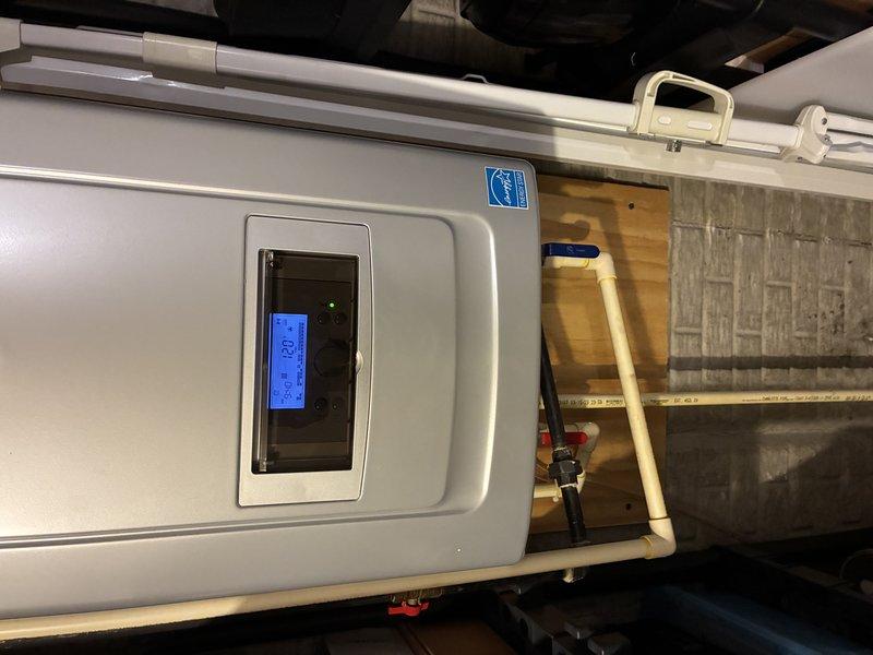 Performed on-site evaluation and provided estimate for descaling service on tankless water heater unit. Inspected unit's digital control panel displaying system parameters and assessed overall equipment condition. Evaluated existing plumbing connections, PVC piping configuration, and water treatment system integration to determine descaling requirements and service approach.