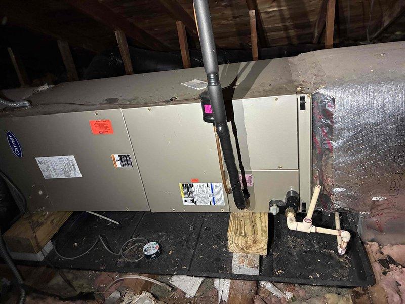 Performed routine air handler tune-up in response to customer report of unusual noise during system operation. Conducted comprehensive inspection of Carrier air handler unit in attic, verifying all mechanical components, electrical connections, and ductwork integrity. Connected manifold gauges to outdoor condensing unit to check refrigerant pressures and system performance, confirming proper operating parameters and resolving noise concern through standard maintenance procedures.