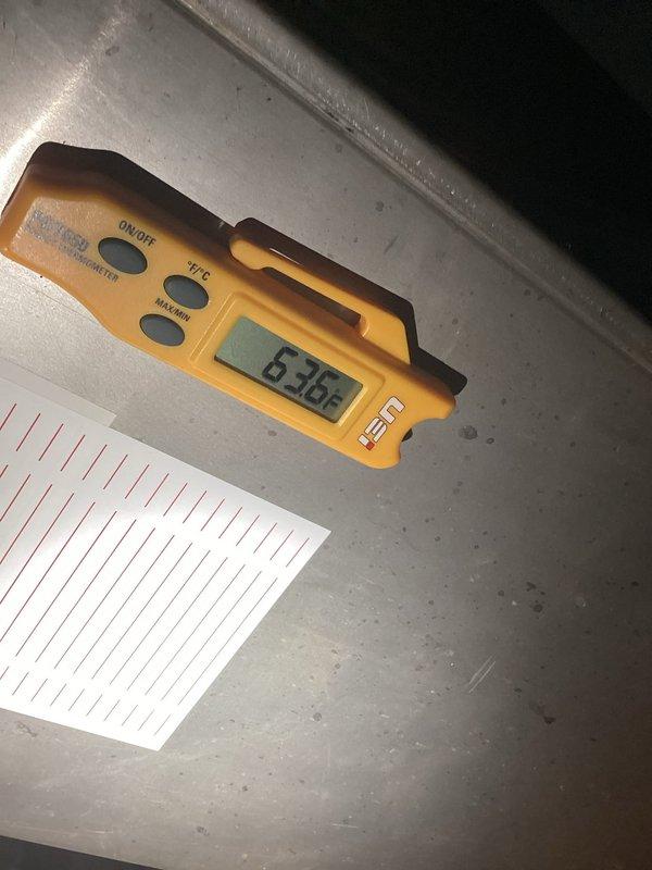 Completed AC system startup and testing on newly installed equipment. Connected refrigerant gauge manifold to service ports and verified proper refrigerant charge levels and system pressures. Measured supply air temperature at register showing 65°F with 6.35 degree temperature split, confirming adequate cooling performance. System operational and performing within manufacturer specifications.
