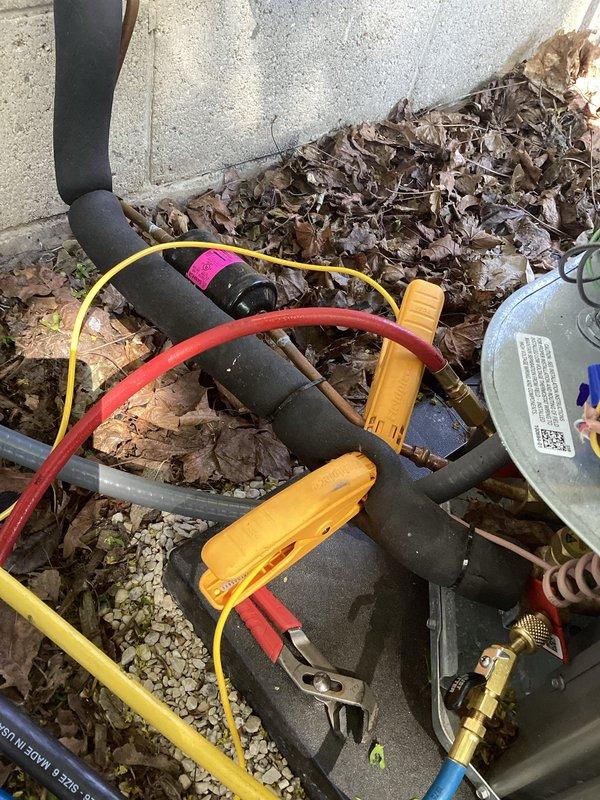 Completed AC system startup and testing on newly installed equipment. Connected refrigerant gauge manifold to service ports and verified proper refrigerant charge levels and system pressures. Measured supply air temperature at register showing 65°F with 6.35 degree temperature split, confirming adequate cooling performance. System operational and performing within manufacturer specifications.