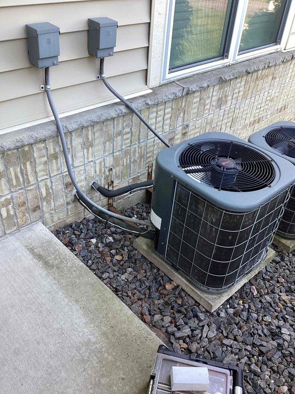 Responded to no-charge callback for air conditioning unit blowing warm air following previous service where refrigerant was added to low system. Upon arrival, inspected outdoor condenser units and indoor air handler components. Verified system was again low on refrigerant charge, confirming active leak in system as previously documented. Recommended leak detection service and repair to properly address underlying issue, as continued refrigerant additions without leak repair will result in recurring system failure and potential compressor damage.