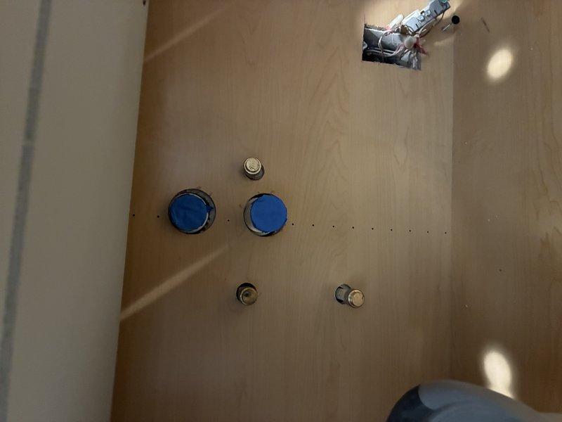 Reconnected kitchen faucet supply lines and drain assembly following cabinet installation. Verified all connections for proper seal and tested water flow and drainage to ensure no leaks at fixture or under-sink plumbing components.