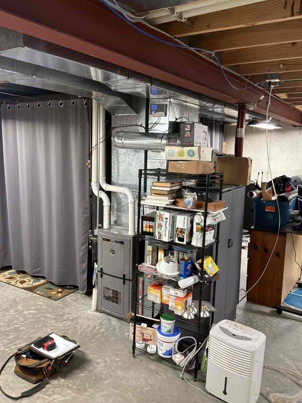 Conducted estimate for complete HVAC system replacement in residential property with original equipment struggling to maintain cooling capacity during summer months when outdoor temperatures reach mid-90s. Evaluated existing natural gas furnace and air conditioning system located in basement utility area, noting aging equipment with diminished performance and inadequate temperature control on upper levels. Assessed ductwork configuration, electrical connections, condensate drainage system, and available space for new equipment installation to provide comprehensive replacement recommendations and system sizing requirements.