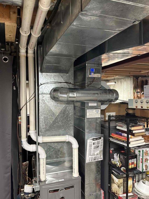 Conducted estimate for complete HVAC system replacement in residential property with original equipment struggling to maintain cooling capacity during summer months when outdoor temperatures reach mid-90s. Evaluated existing natural gas furnace and air conditioning system located in basement utility area, noting aging equipment with diminished performance and inadequate temperature control on upper levels. Assessed ductwork configuration, electrical connections, condensate drainage system, and available space for new equipment installation to provide comprehensive replacement recommendations and system sizing requirements.