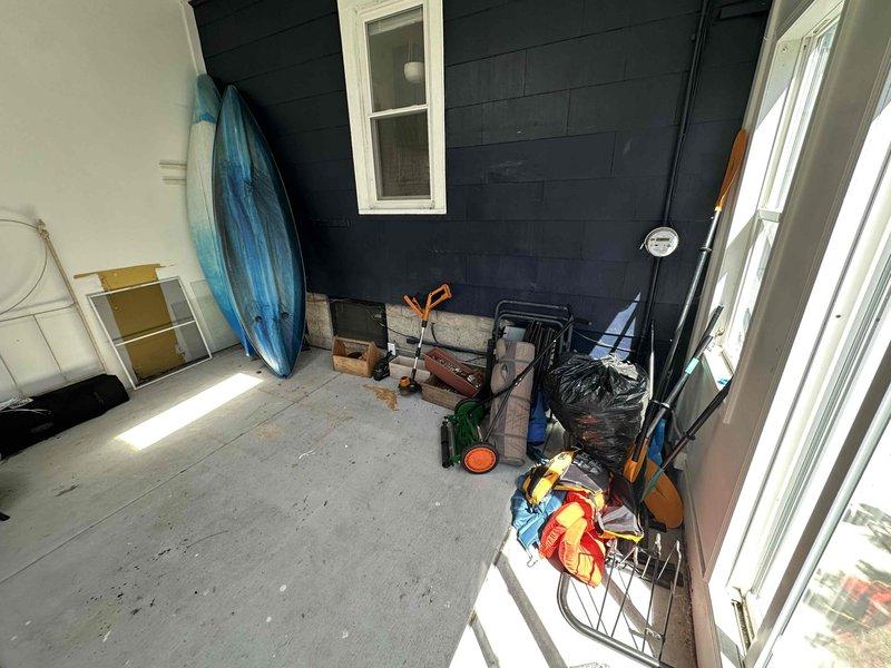 Conducted on-site evaluation for mini-split installation at residential property. Assessed exterior wall locations and porch area for optimal placement of outdoor condenser unit and indoor air handler, taking measurements and documenting existing conditions to prepare detailed installation proposal.