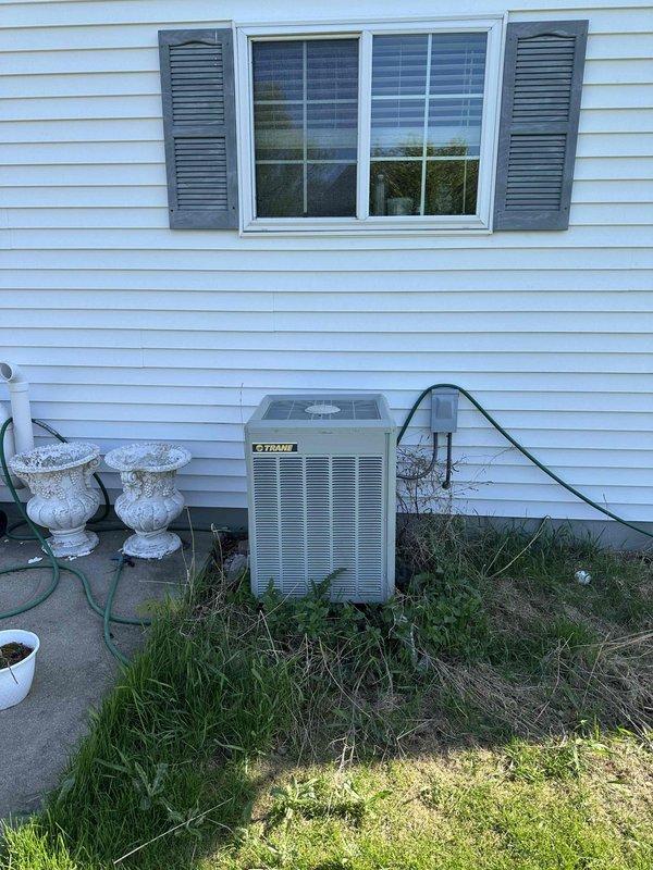 Conducted estimate for replacement of 25-year-old furnace and air conditioning system currently located in basement. Customer requesting Lennox equipment upgrade; existing system operational but at end of service life. Documented current electrical panel configuration and exterior condensing unit for replacement specifications.