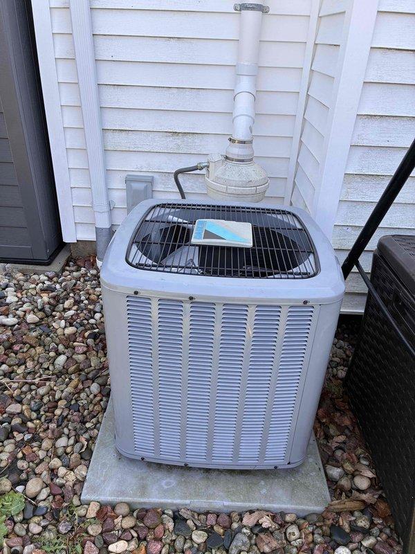 Completed comprehensive furnace and air conditioning tune-up maintenance service. Performed full system inspection of outdoor condensing unit, including removal of fan guard to access and clean internal components, checked refrigerant levels, inspected electrical connections, and verified proper operation of both heating and cooling systems.