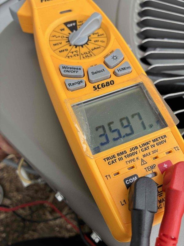 Completed membership tune-up on outdoor HVAC unit, performing standard diagnostic testing and preventive maintenance procedures. Replaced UV bulb as part of service call. Multimeter readings confirmed system operating within normal parameters at 359.7 volts, indicating proper electrical supply to unit. Condenser coils showed moderate accumulation of environmental debris and weathering consistent with normal outdoor exposure.