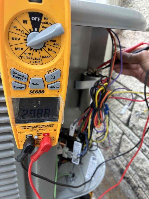 Completed scheduled cooling system maintenance visit as part of membership agreement. Performed comprehensive inspection of outdoor condensing unit, including visual examination of compressor, refrigerant lines, and condenser coils. Conducted electrical diagnostics using digital multimeter, measuring capacitance reading of 29.08 MFD at the control board terminal connections. Verified all wire connections secure at junction points and confirmed proper electrical values throughout the system for safe operation.