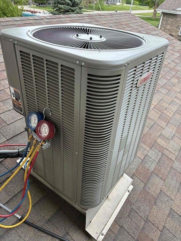 Performed seasonal air conditioning tune-up on rooftop-mounted Lennox unit. Connected manifold gauge set to verify refrigerant pressures and system operation, confirming all parameters within manufacturer specifications. Unit tested and left in proper working condition.