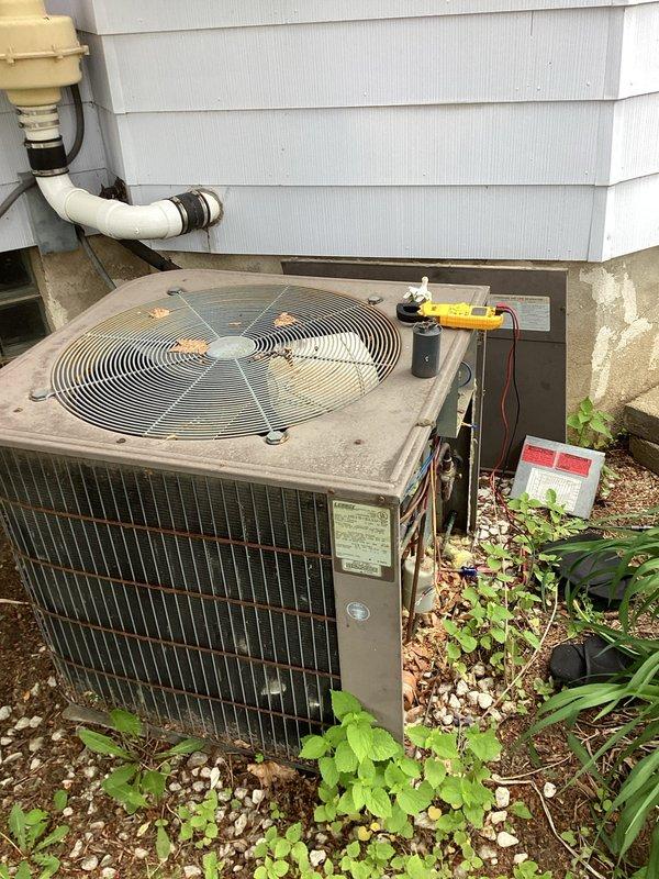 Responded to no-cooling call on residential air conditioning system. Upon arrival, performed comprehensive diagnostic evaluation of outdoor condensing unit. Utilized digital multimeter to test electrical components including capacitor functionality and voltage readings. Verified system would not start as reported. Completed thorough inspection of condenser coil, fan motor operation, and electrical connections. Performed standard AC tune-up maintenance including cleaning of condenser coils, checking refrigerant levels, and testing all safety controls. System restored to proper operating condition and verified cooling cycle functionality before departure.