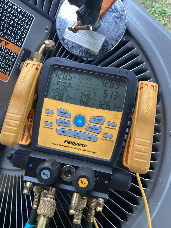 Completed installation of new air conditioning system with evaporator coil and 15-foot refrigerant line set. System was properly charged, leak tested, and verified operational with digital manifold gauges confirming appropriate temperatures and pressures across both indoor and outdoor units.