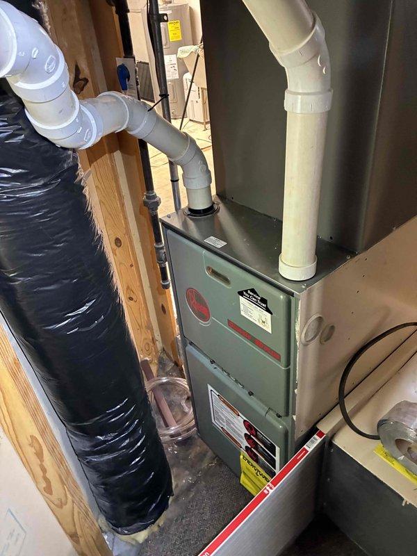 Responded to no cooling call on system installed in 2023. Upon arrival, performed diagnostic evaluation of HVAC equipment including furnace and air handler components. Inspected system installation, verified proper PVC condensate drainage routing, checked electrical connections, and examined ductwork configuration. System components appeared to be in good condition with proper installation standards observed. Completed troubleshooting procedures and restored cooling operation to unit.