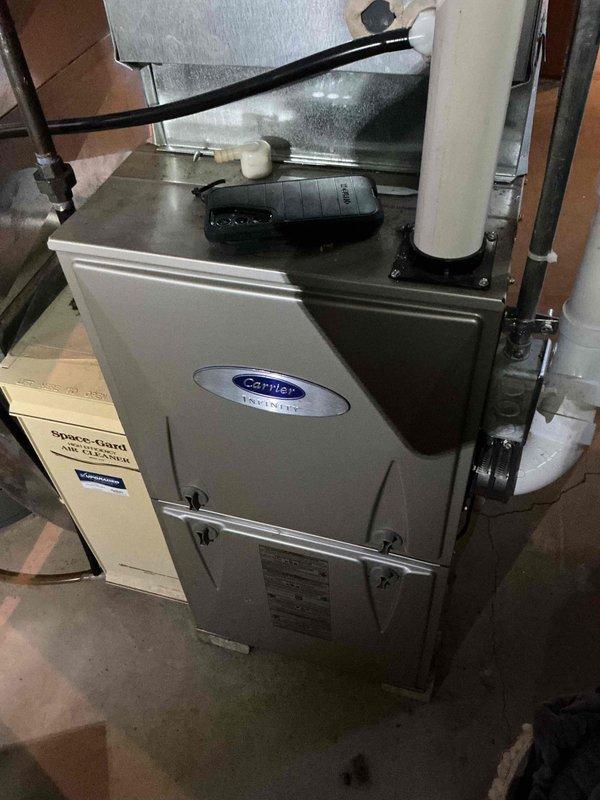 Responded to no cooling call on 10+ year old Carrier system. Upon arrival, unit was running but delivering only ambient air with no refrigeration. Diagnosed failed dual run capacitor in outdoor condensing unit. Replaced defective capacitor with properly rated replacement, restoring compressor and condenser fan motor operation. Verified system cooling performance and proper amp draw on all components before departure.