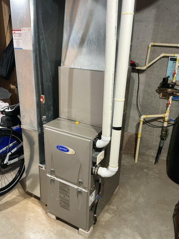 Completed preventive maintenance cooling visit on Carrier residential air conditioning system as part of prepaid membership agreement. Inspected outdoor condensing unit positioned on rubber pad with proper gravel drainage, confirmed unit integrity with no visible damage to protective grille or coil fins. Evaluated indoor furnace and ductwork connections, verified proper gas line installation and venting configuration. System operating within normal parameters with all components in good working condition.
