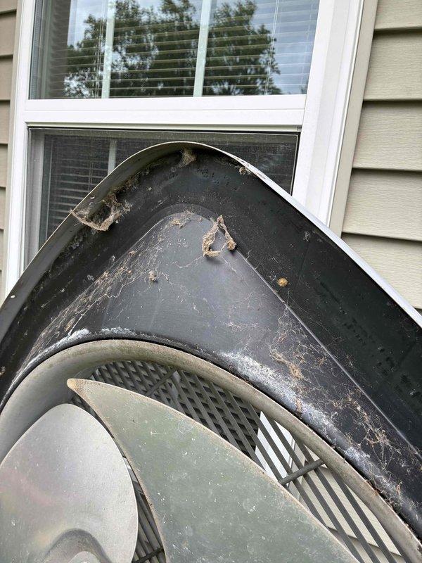 Completed prepaid cooling maintenance visit on residential HVAC system. Performed standard diagnostic testing including temperature measurements, which indicated system operating at 430°F at tested component. Inspected outdoor condensing unit, noting weathered exterior housing with visible deterioration and debris accumulation on protective cover, though unit remains operational with adequate ventilation through lower mesh components.