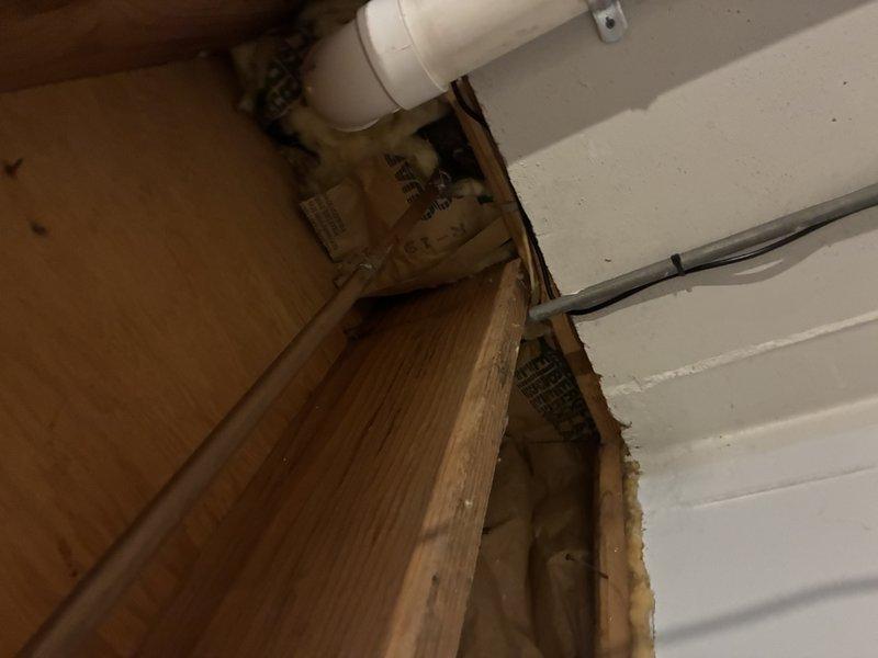 Conducted comprehensive plumbing inspection and provided estimate for multiple system components and repairs. Verified functionality of water shut-off valves throughout property, tested hose bibs, and confirmed operation of primary water shut-off valve. Inspected bathroom shower piping and documented deteriorating conditions requiring repair, noting visible corrosion and mineral buildup at drain fixture. Evaluated existing water heater installation and assessed need for replacement unit with proper drip pan and code-compliant shut-off valves. Examined sump pump system and discussed potential installation of secondary backup pump for redundancy. Inspected washing machine discharge tube routing and drainage connections. Documented plumbing infrastructure in utility areas including exposed piping, mounting brackets, and accessibility for future service work. Photographed areas of concern for customer review and estimate preparation.