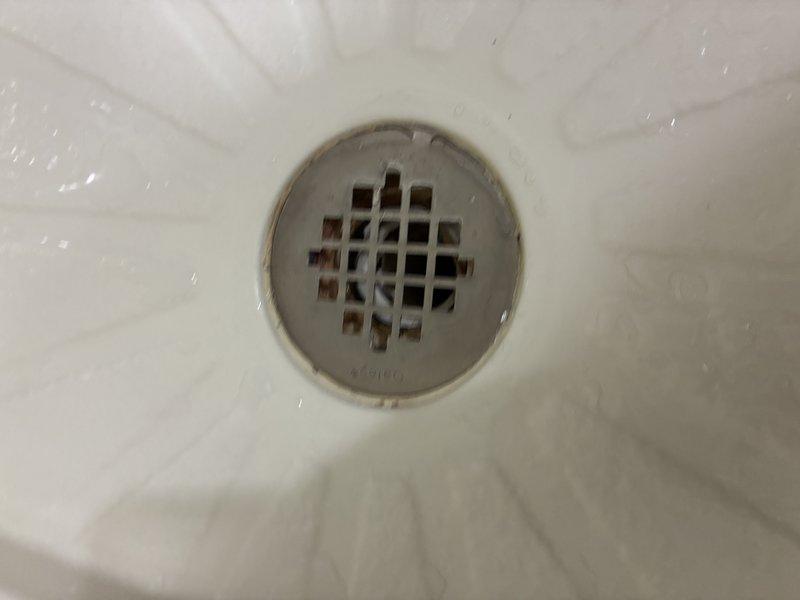 Conducted comprehensive plumbing inspection and provided estimate for multiple system components and repairs. Verified functionality of water shut-off valves throughout property, tested hose bibs, and confirmed operation of primary water shut-off valve. Inspected bathroom shower piping and documented deteriorating conditions requiring repair, noting visible corrosion and mineral buildup at drain fixture. Evaluated existing water heater installation and assessed need for replacement unit with proper drip pan and code-compliant shut-off valves. Examined sump pump system and discussed potential installation of secondary backup pump for redundancy. Inspected washing machine discharge tube routing and drainage connections. Documented plumbing infrastructure in utility areas including exposed piping, mounting brackets, and accessibility for future service work. Photographed areas of concern for customer review and estimate preparation.