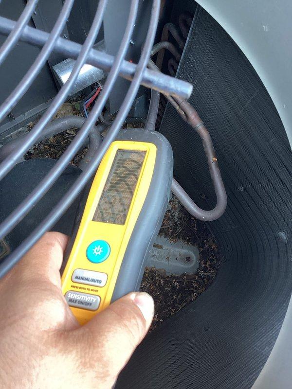 Responded to no cooling complaint on duplex unit. Upon arrival, performed diagnostic testing using digital manifold gauges and found system operating on R410A refrigerant with abnormal pressures (472 PSIG high side, 77 PSIG low side). Utilized temperature clamps to verify superheat and subcooling readings. Unit showed signs of neglected maintenance with debris accumulation in condenser section and dirty coil fins. Confirmed refrigerant charge deficiency as primary cause of no cooling condition. As requested, checked pressures on adjacent duplex unit to verify system integrity on other side of property.