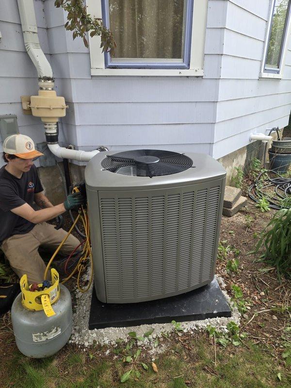 Completed installation of new air conditioning system with matching evaporator coil at residential property. Installed outdoor condensing unit on equipment pad with proper refrigerant line connections, performed system startup, and verified proper operation using manifold gauges to ensure correct refrigerant charge and pressures.