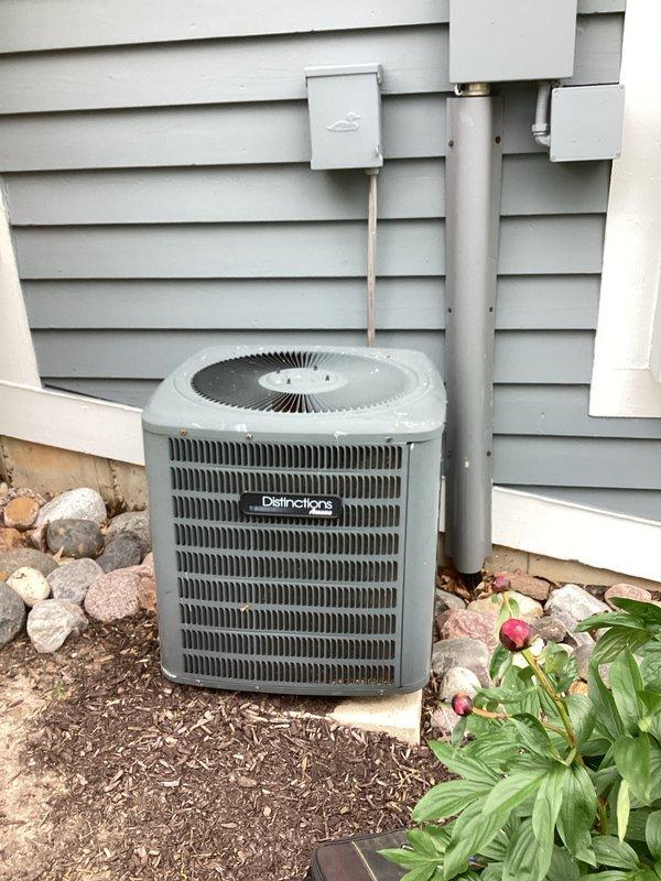 Responded to no cool air complaint on aging Distinctions brand air conditioning system. Upon arrival, performed diagnostic evaluation of both indoor air handler and outdoor condensing unit. Inspected ductwork in mechanical room showing dust accumulation and verified airflow pathways. Examined outdoor unit positioned on concrete pad with proper clearances maintained. Assessed system components including condenser coil, electrical connections at disconnect box, and refrigerant line set. Unit restored to proper cooling operation with homeowner satisfied with results.