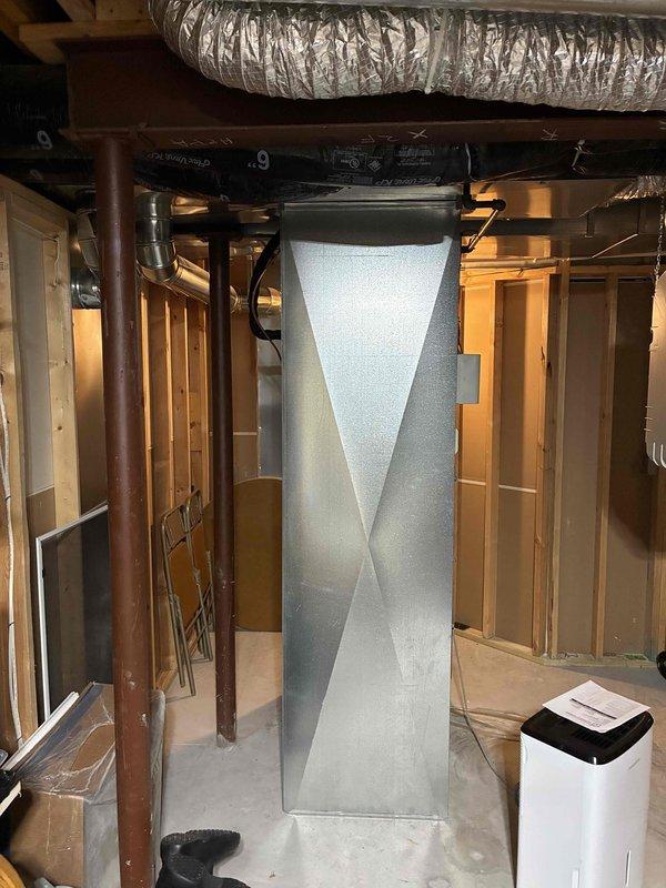 Conducted on-site evaluation of existing Armstrong furnace and air conditioning system in residential basement installation. Assessed current equipment sizing and determined unit is likely oversized for the home's heating and cooling requirements. Documented existing HVAC configuration including ductwork layout, flexible and rigid duct connections, copper refrigerant lines, and exhaust flue system. Photographed equipment placement in confined mechanical room with exposed framing to evaluate spatial constraints for replacement installation. Provided equipment replacement estimate featuring Daikin and Bryant system options properly sized for the residence. Coordinated arrival window and maintained communication protocol for scheduled appointment.