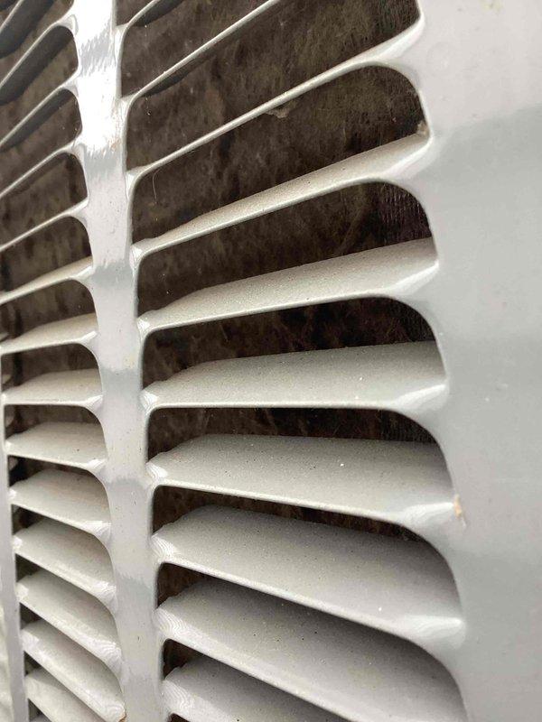 Completed scheduled biannual air conditioning tune-up and preventive maintenance as part of recurring service agreement. Inspected system components, documented heavily soiled return air filter and debris accumulation in ventilation grilles requiring attention to maintain optimal airflow and system efficiency.