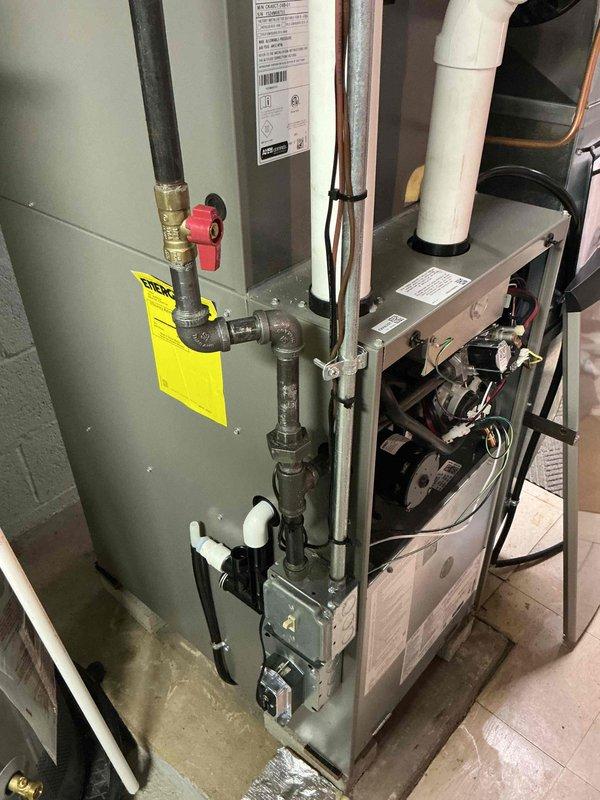 Responded to warranty call for gas leak at furnace. Upon arrival, inspected gas piping connections and identified severely corroded gas line fittings and union joints at furnace inlet. Corrosion was extensive with visible rust deterioration and flaking on threaded connections, posing immediate safety hazard. Shut off gas supply and replaced corroded gas piping components with new approved materials. Pressure tested all gas connections per code requirements and performed leak detection using approved methods. Confirmed no leaks present at any connections. Restored gas service and verified proper furnace operation. System operating safely within manufacturer specifications.