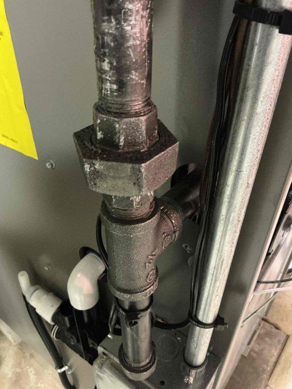 Responded to warranty call for gas leak at furnace. Upon arrival, inspected gas piping connections and identified severely corroded gas line fittings and union joints at furnace inlet. Corrosion was extensive with visible rust deterioration and flaking on threaded connections, posing immediate safety hazard. Shut off gas supply and replaced corroded gas piping components with new approved materials. Pressure tested all gas connections per code requirements and performed leak detection using approved methods. Confirmed no leaks present at any connections. Restored gas service and verified proper furnace operation. System operating safely within manufacturer specifications.