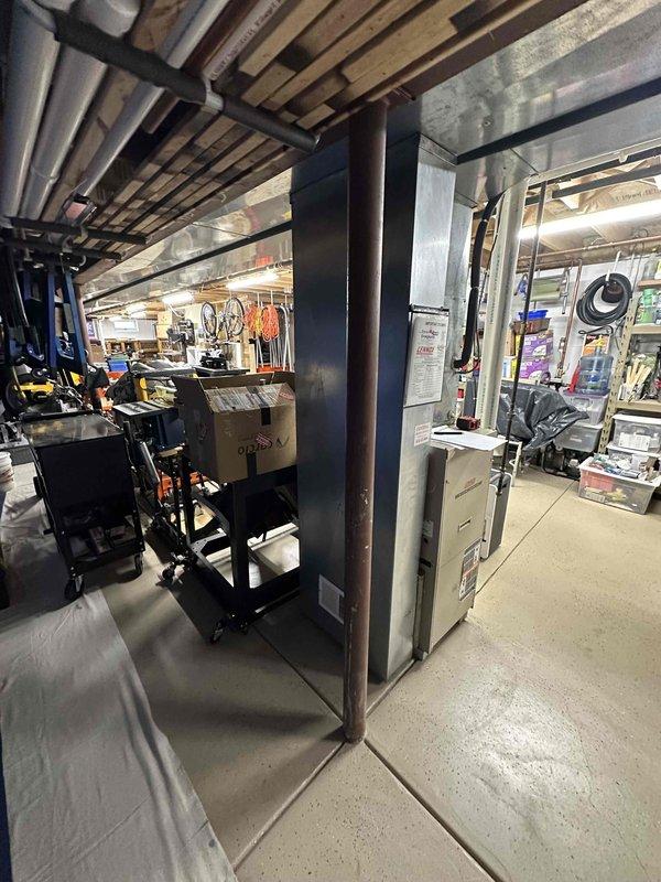 Completed comprehensive estimate for full HVAC system replacement in residential basement mechanical room. Assessed existing Lennox furnace unit and air conditioning system, evaluated current ductwork configuration including metal plenum and distribution system, and documented existing equipment layout and clearances. Provided homeowner with replacement options for both heating and cooling equipment suitable for the existing infrastructure and space requirements.