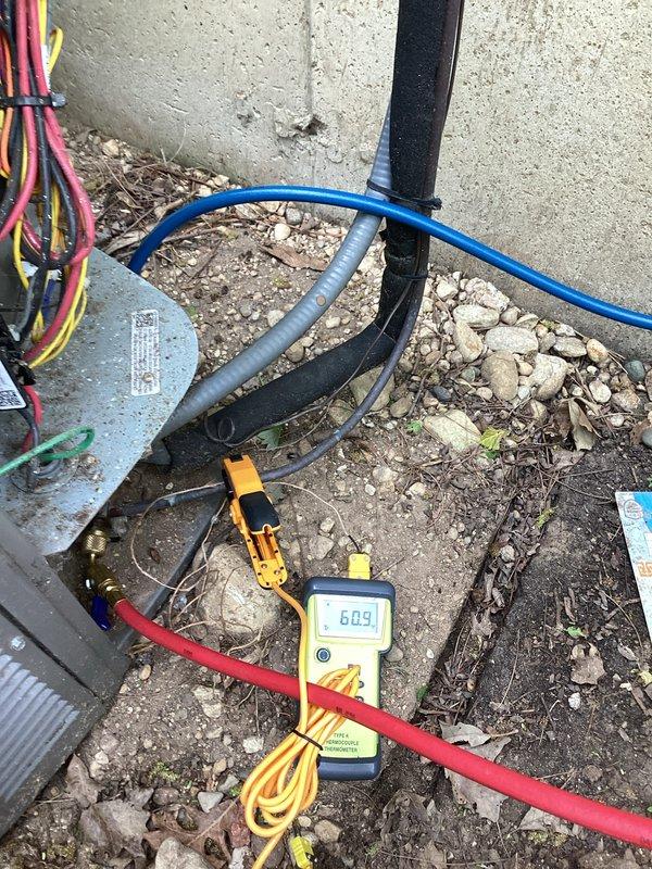 Performed comprehensive air conditioning tune-up service utilizing Yellow Jacket TITAN 4-valve manifold gauge set to measure system pressures and verify proper refrigerant charge levels. System diagnostics showed readings of 609 PSI, and all refrigerant lines, electrical connections, and service ports were inspected to ensure optimal performance and system efficiency.