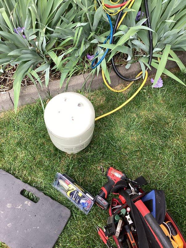 Responded to no cooling complaint with water leakage underneath unit. Upon arrival, connected refrigerant manifold gauges to outdoor condensing unit and performed system diagnostics. Pressure and temperature readings were obtained to assess refrigerant charge and system operation, identifying the source of the cooling failure and water discharge issue.