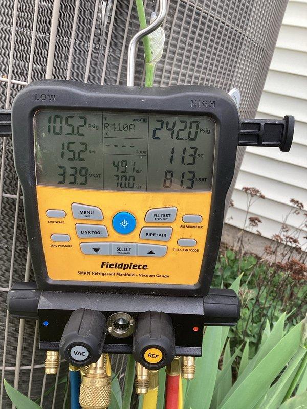 Responded to no cooling complaint with water leakage underneath unit. Upon arrival, connected refrigerant manifold gauges to outdoor condensing unit and performed system diagnostics. Pressure and temperature readings were obtained to assess refrigerant charge and system operation, identifying the source of the cooling failure and water discharge issue.