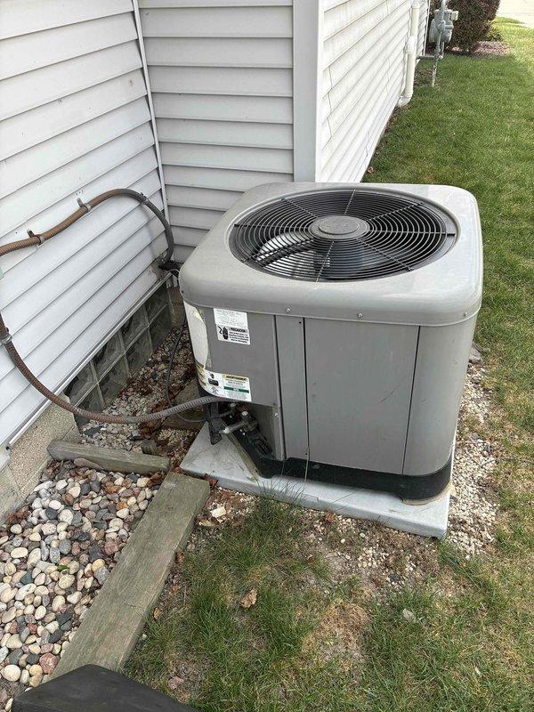 Completed comprehensive AC tune-up on residential outdoor condensing unit, including inspection of ZETTLER Controls contactor (model 42-102864-06), verification of all electrical connections and terminal tightness, and visual assessment of refrigerant line set routing and exterior unit condition. All components found operating within normal parameters with secure wire connections at contactor terminals and proper unit placement on concrete pad with adequate clearances.
