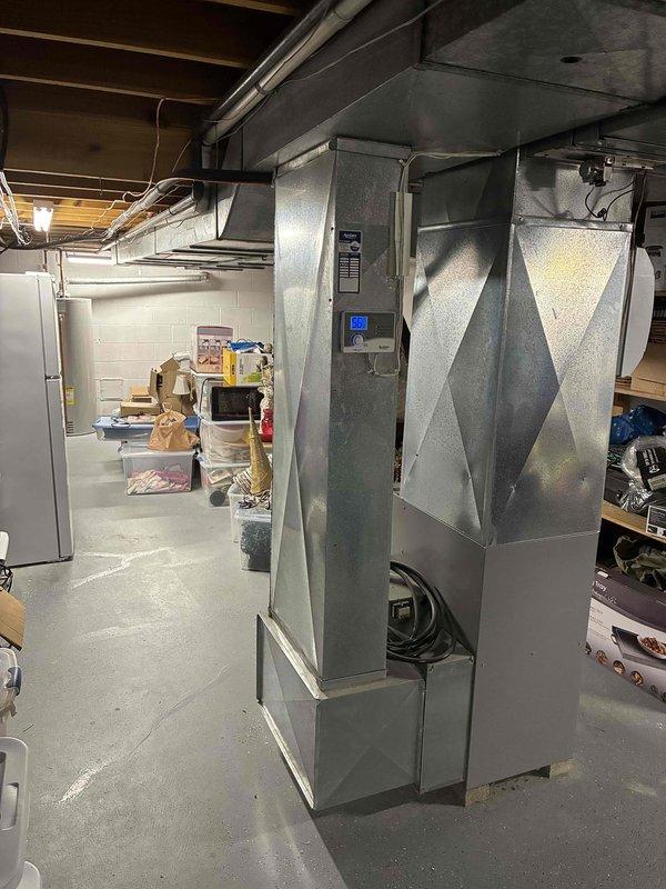 Conducted on-site evaluation of non-operational HVAC system that ceased functioning during previous cooling season. Assessed existing furnace unit located in basement utility area and documented electrical panel configuration with digital monitoring display. Provided comprehensive replacement estimate for complete HVAC system installation to restore climate control functionality to the residence.