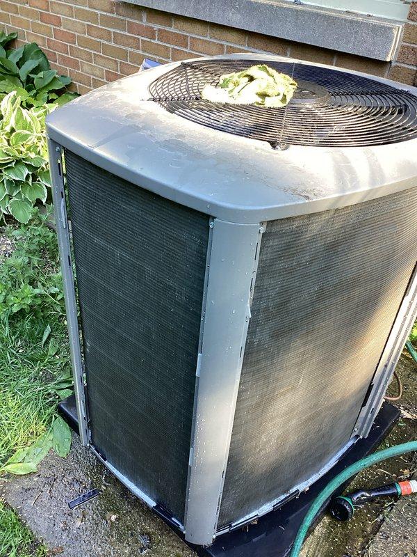 Completed routine cooling system maintenance as part of prepaid membership visit. Performed standard inspection of outdoor condensing unit, which showed normal weathering consistent with typical outdoor installation. Removed debris (plastic bag and organic material) from top of fan guard to ensure proper airflow and prevent potential system efficiency issues. Unit operational and functioning within normal parameters.