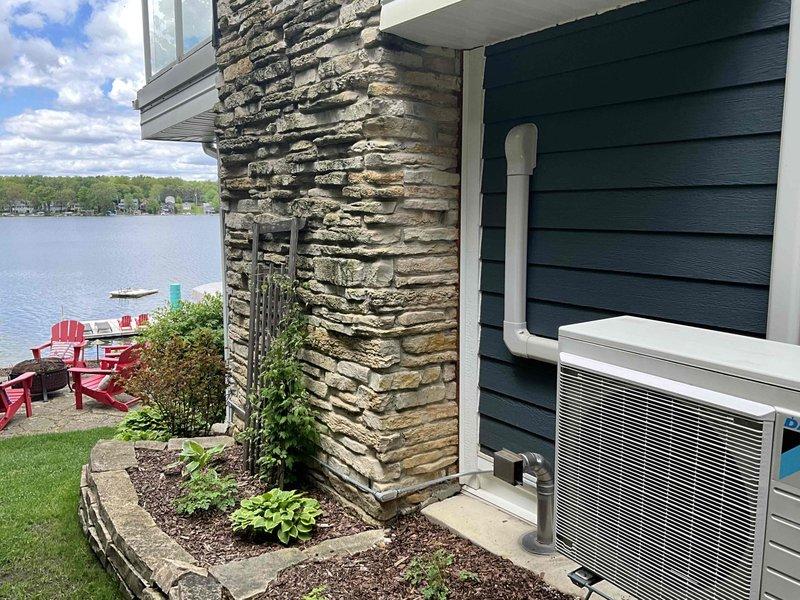 Conducted on-site evaluation for bedroom mini-split installation options at lakefront residence. Assessed existing outdoor heat pump unit and attic infrastructure to determine feasibility of either installing a standalone single-head mini-split system or upgrading current outdoor unit to accommodate an additional indoor head for the bedroom zone. Documented existing mechanical systems, refrigerant line routing possibilities through attic space, and electrical capacity for proposed installation.