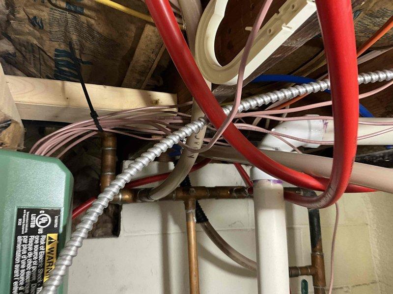 Conducted on-site evaluation for bedroom mini-split installation options at lakefront residence. Assessed existing outdoor heat pump unit and attic infrastructure to determine feasibility of either installing a standalone single-head mini-split system or upgrading current outdoor unit to accommodate an additional indoor head for the bedroom zone. Documented existing mechanical systems, refrigerant line routing possibilities through attic space, and electrical capacity for proposed installation.