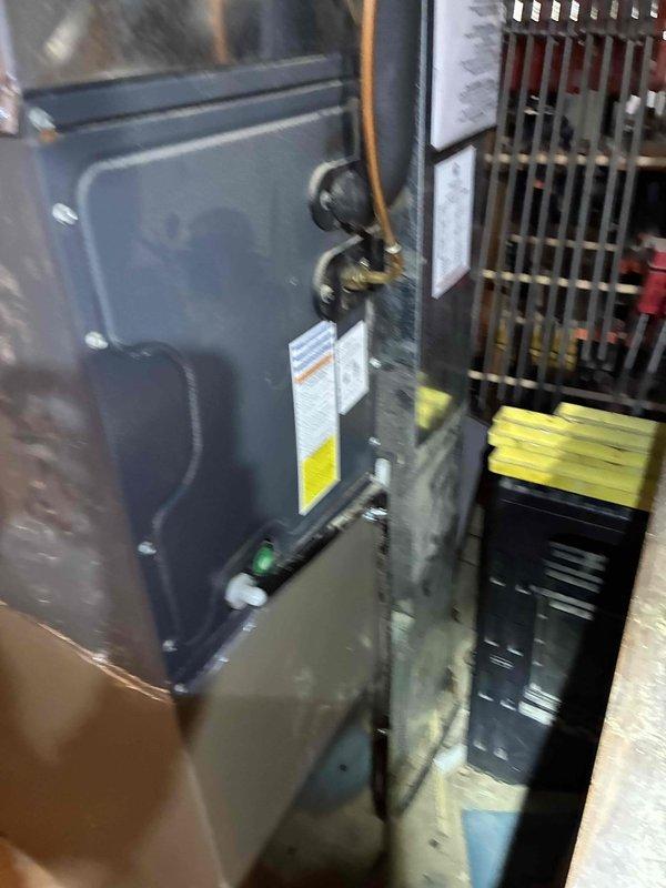 Performed system start-up on newly installed AC unit following incomplete initial installation. Installation crew had not operated the system, assuming the short lineset run would be adequate. Upon start-up inspection, discovered significant frost accumulation on evaporator coil, indicating improper refrigerant charge or restricted airflow. Documented equipment conditions with photos showing indoor air handler, copper line connections, and excessive ice buildup on coil surface. System requires further diagnostic evaluation and potential refrigerant adjustment to resolve icing issue before final commissioning can be completed.