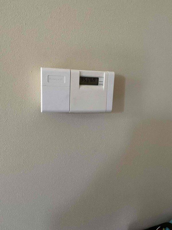 Conducted comprehensive estimate for complete HVAC system replacement at residential property. Existing air conditioning unit operating at minimal capacity and requiring replacement along with furnace system located in basement. Assessed current electrical panel configuration, existing thermostat controls, and infrastructure requirements for new equipment installation. Documented existing Honeywell thermostat and electrical service panel with proper circuit protection. Reviewed available equipment upgrade options and promotional offerings with homeowner, including enhanced air conditioning system paired with furnace replacement package to maximize system efficiency and performance.